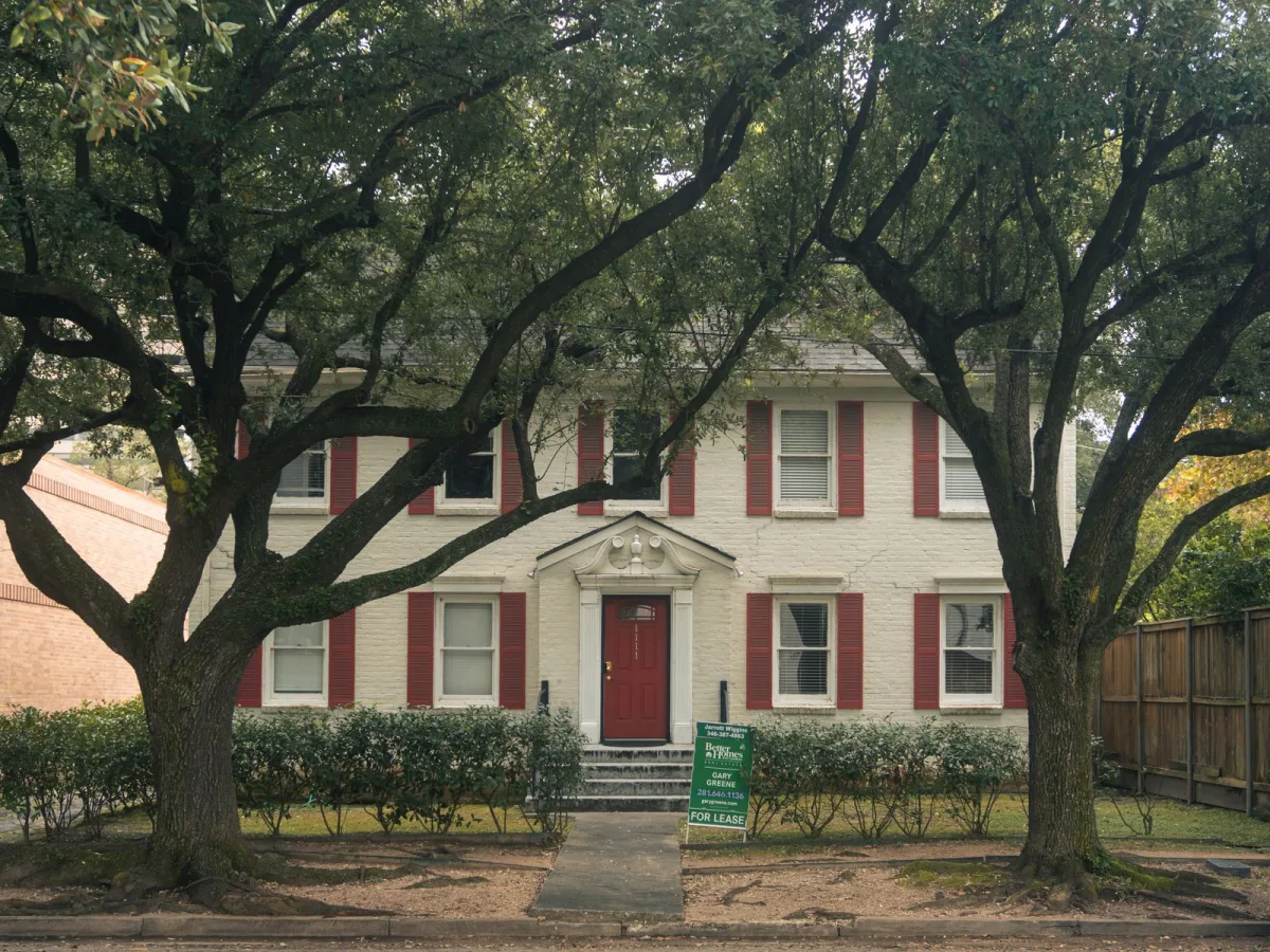 Colonial-style home among mature trees in The Woodlands, TX area