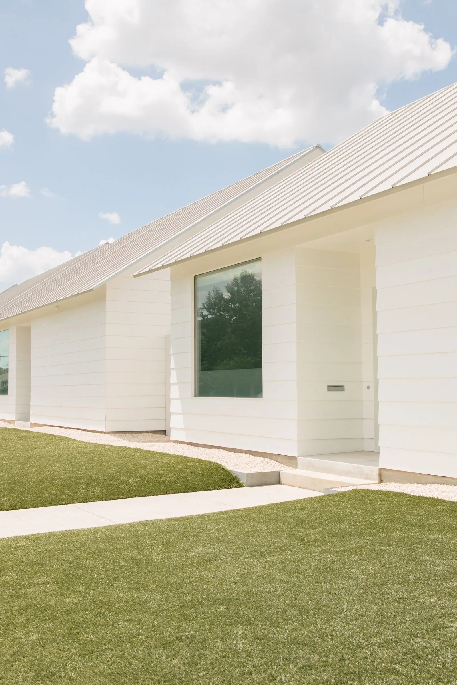 Modern white two-story home in the Houston, TX area — the kind of home Velen Home installs water treatment systems in